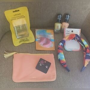 7: hand sanitizer, ipsy pouch,2 nail polish,hair band,eye mask,earrings